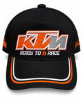 Gorra DERRAPA KTM Negro con naranja, blanco y gris, vista frontal, sobre fondo blanco